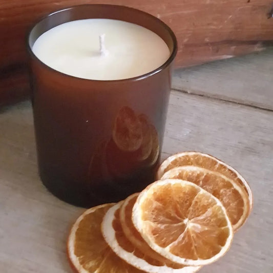 Aromatherapy candle in an amber glass jar